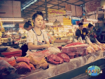 A Thai meat slicer in Lampang Province market in Thailand