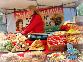 Hungarian saleslady sells varieties of candies in Pecs