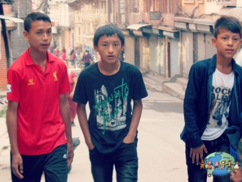 Three Nepali boys stroll around Kathmandu