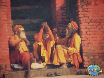 Three Sadhus sit together at Pashupatinath Temple in Kathmandu