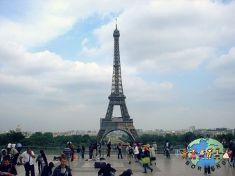 Tourists stroll on the Trocadero square near Eiffel Tower
