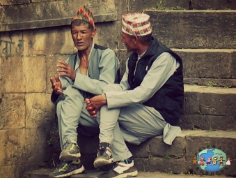 Two Nepali men chat at Pashupatinath Temple in Kathmandu