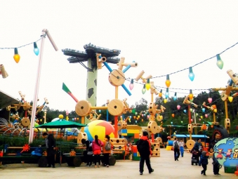 People walk through Hong Kong Disneyland